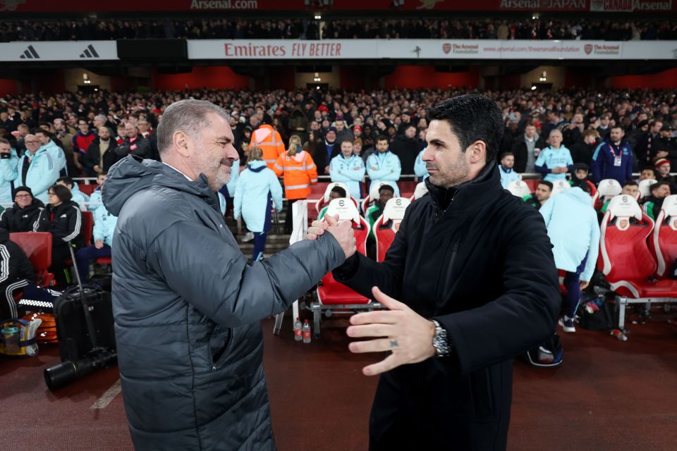 Mikel Arteta and Ange Postecoglou shaking hands at a soccer game.