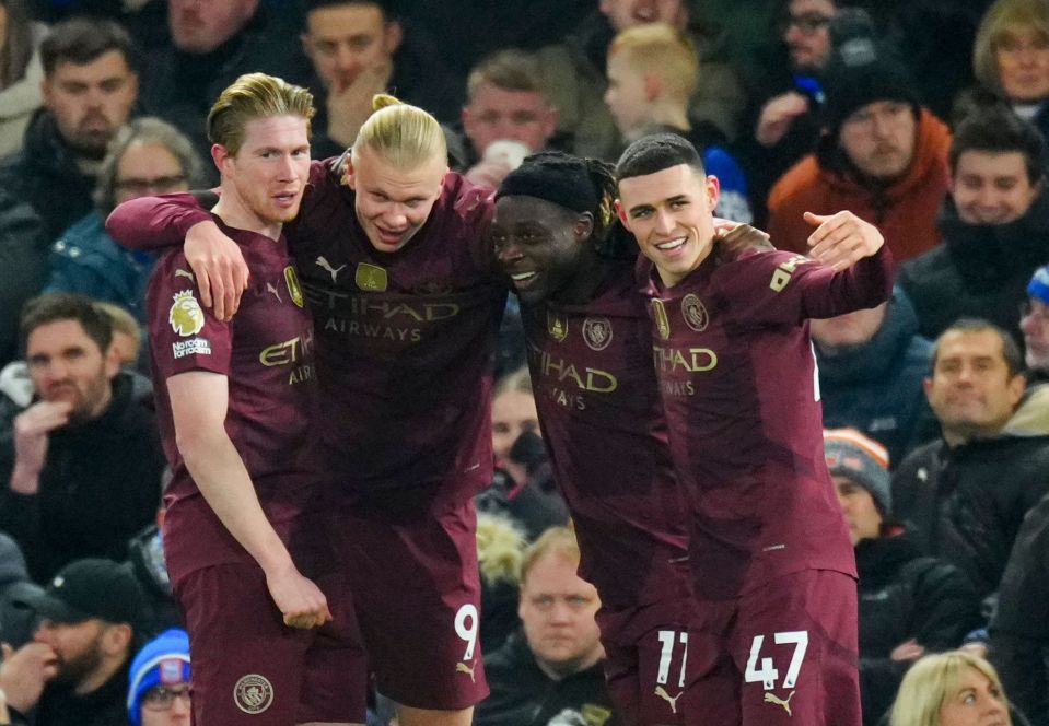 Manchester City players celebrating a goal.