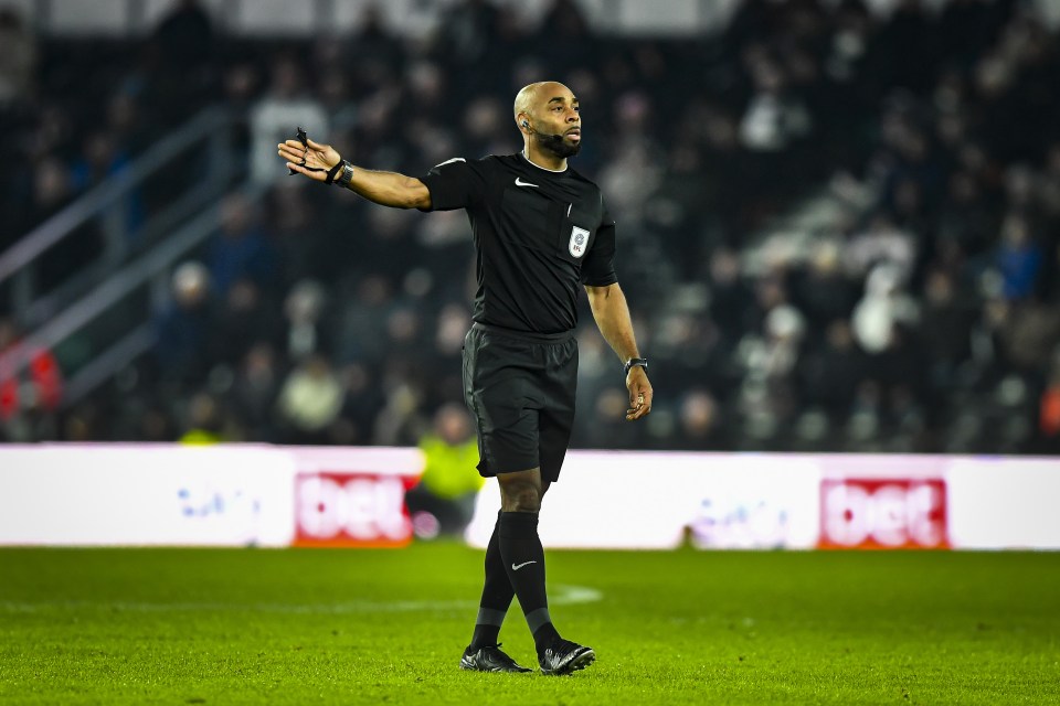 Referee signaling during a soccer game.