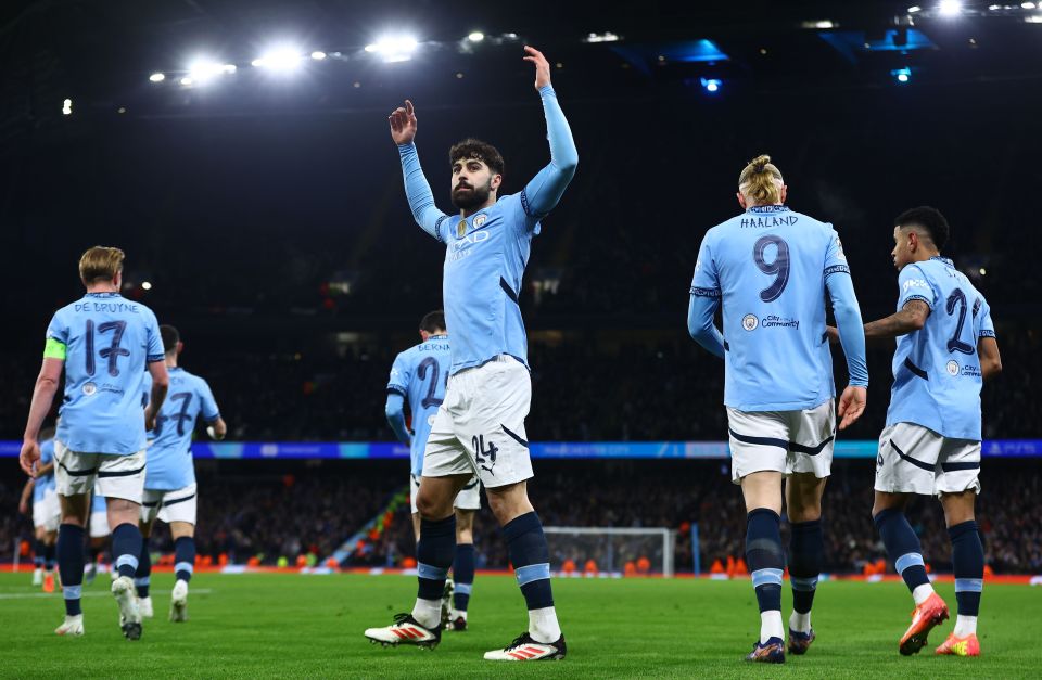 Manchester City players celebrating a goal.