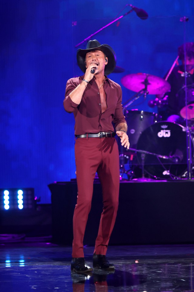 Tim McGraw performing onstage at the iHeartRadio Music Festival.