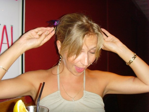 Woman adjusting her hair.