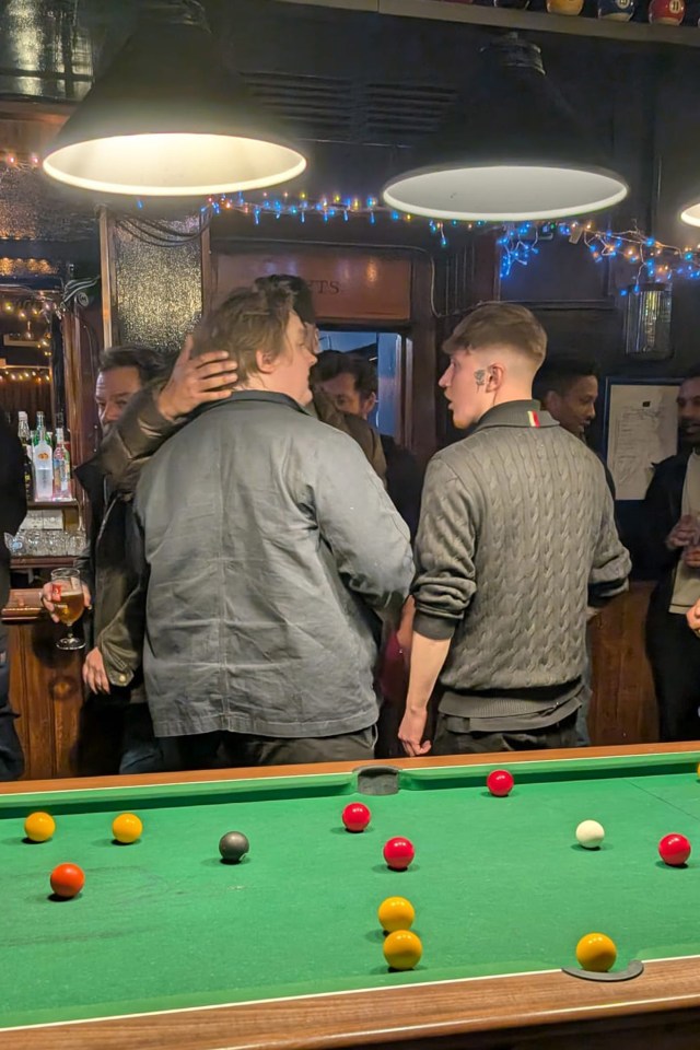 Yungblud, Brian Chatten, and Lewis Capaldi at a pool table in a pub.