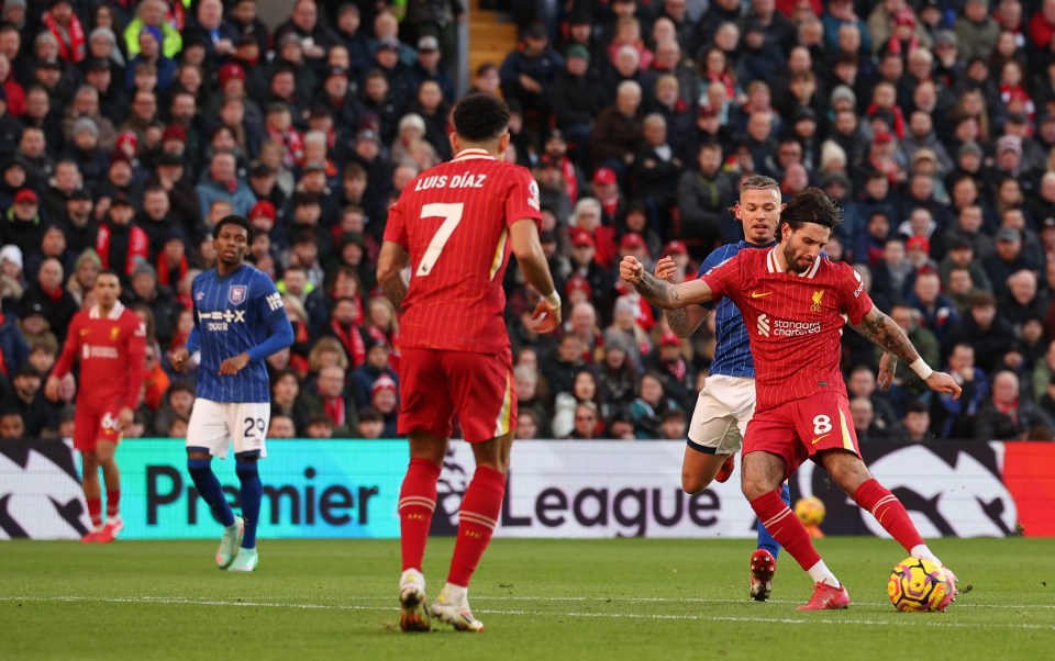 Dominik Szoboszlai of Liverpool scores a goal during a Premier League match.