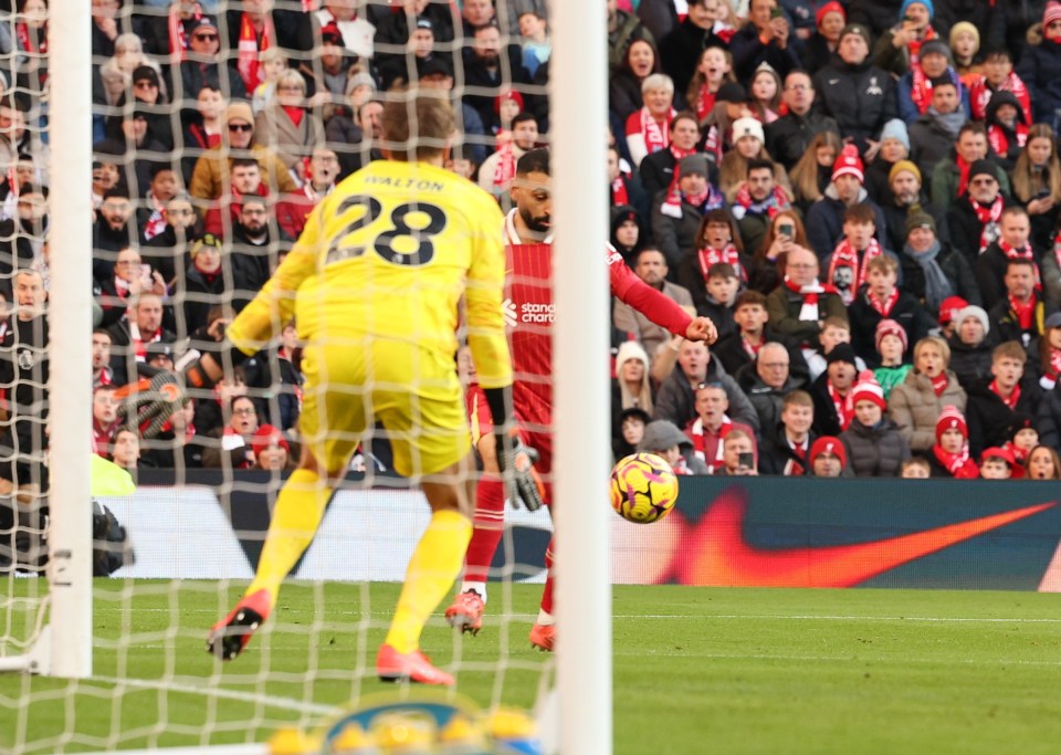 Mohamed Salah scoring a goal for Liverpool.