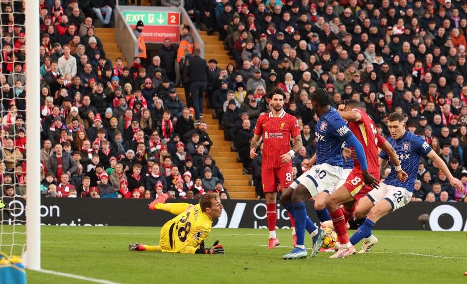 Cody Gakpo of Liverpool scores a goal during a soccer match.