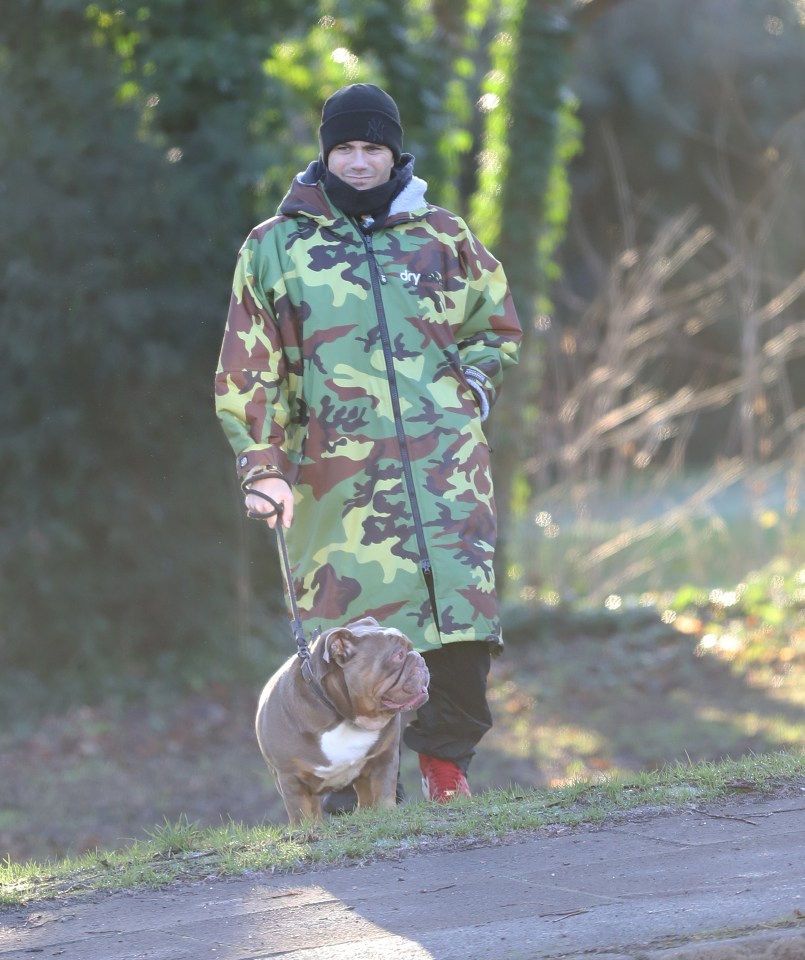 Max George walking his dog.