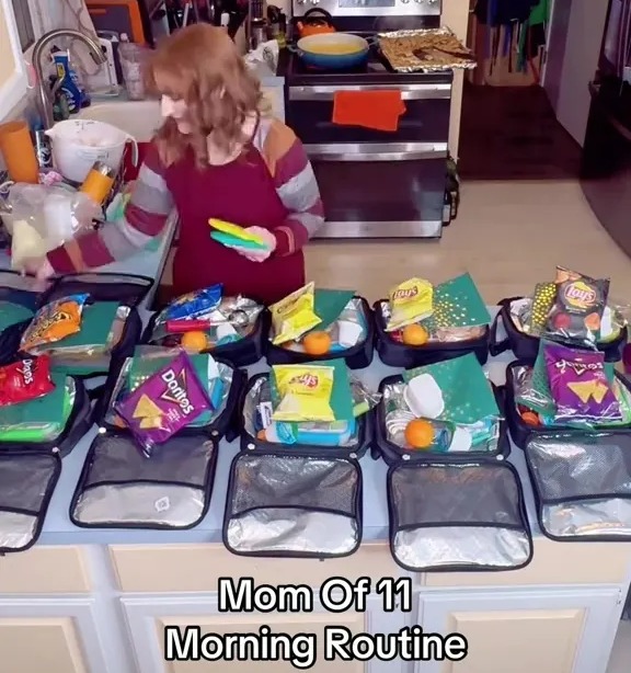 A mother of eleven preparing eleven lunchboxes.