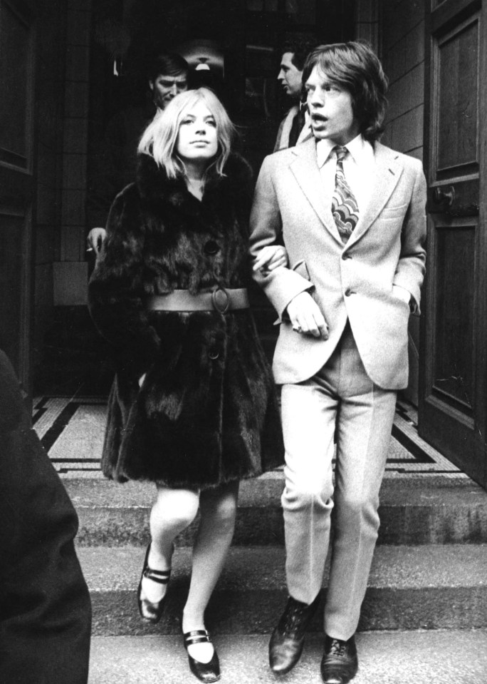 Mick Jagger and Marianne Faithfull leaving a building.