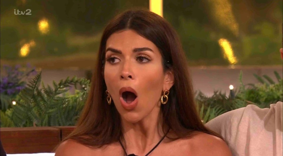 Maya Jama on Love Island, looking shocked.