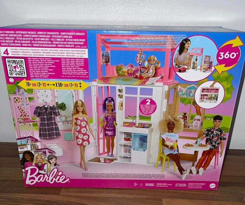 Barbie Dreamhouse box showing the house and dolls.