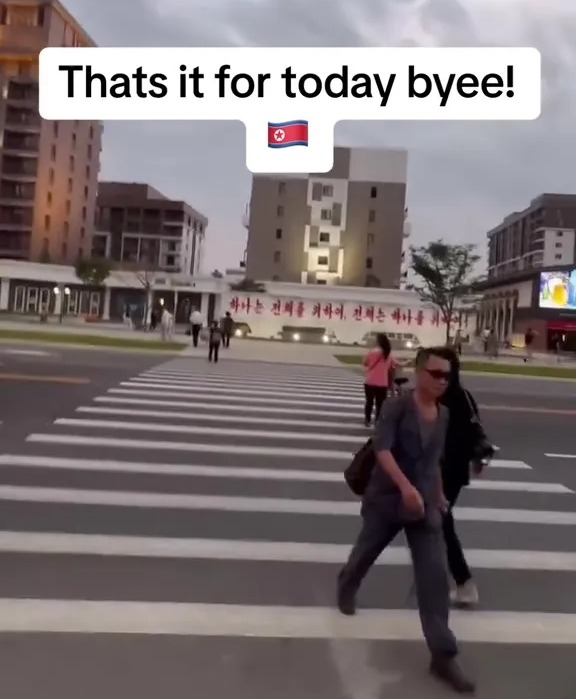 People crossing a street in Pyongyang, North Korea.