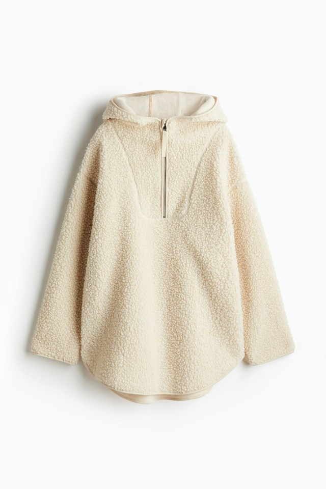 Cream-colored hooded fleece jacket.