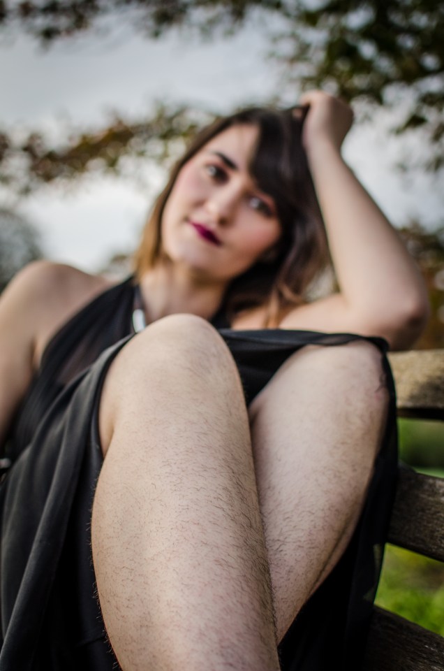 Close-up of a woman's hairy legs.