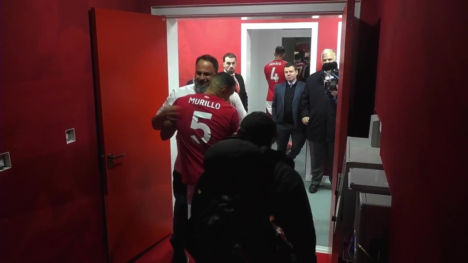 Nottingham Forest owner embracing player Murillo in the locker room.