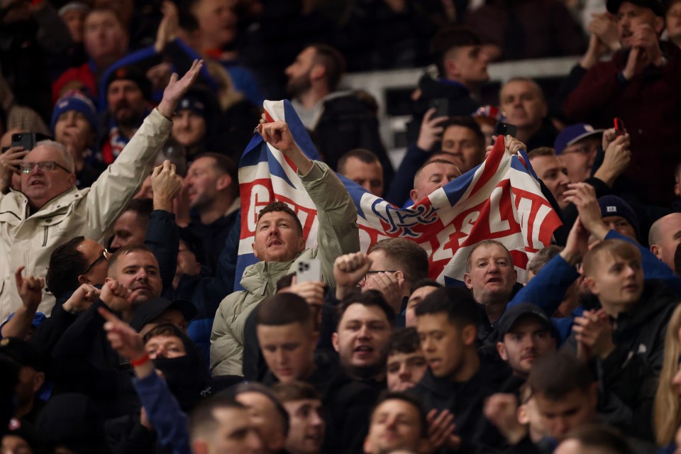 Rangers FC fans cheering at a match.