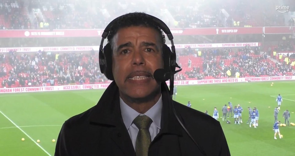 Chris Kamara commentating at a football match.