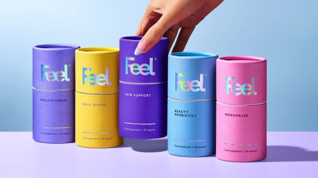 Five tubes of Feel brand supplements: multivitamin, daily biotic, hair support, beauty probiotic+, and menopause.