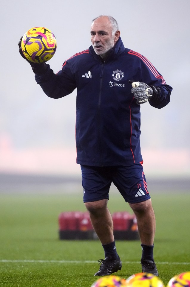 Jorge Vital, Manchester United's goalkeeping coach, holding a soccer ball.