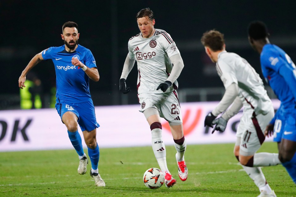 Wout Weghorst of Ajax Amsterdam dribbling the ball during a soccer match.