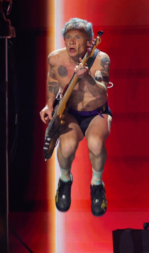 Flea of the Red Hot Chili Peppers performing.