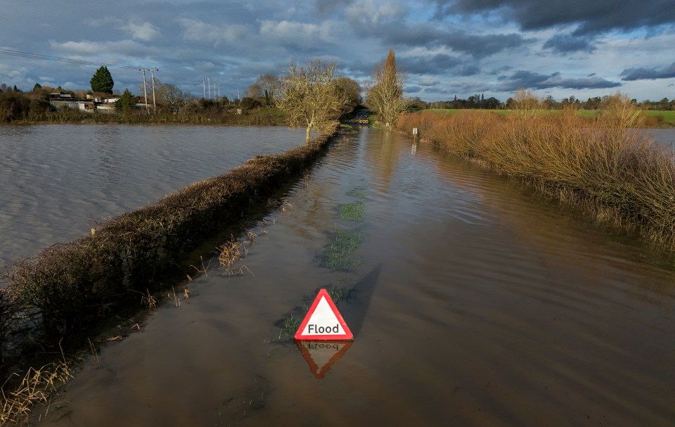 A flooded Eckington Road in Defford, Worcestershire