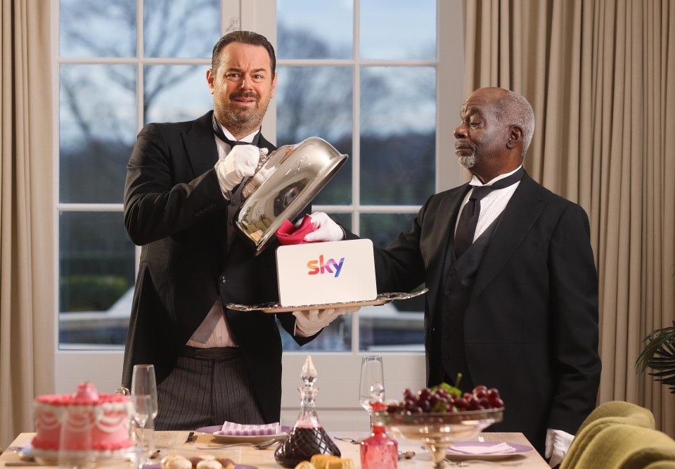 Danny Dyer and Joseph Marcell in butler attire presenting a Sky Broadband logo.