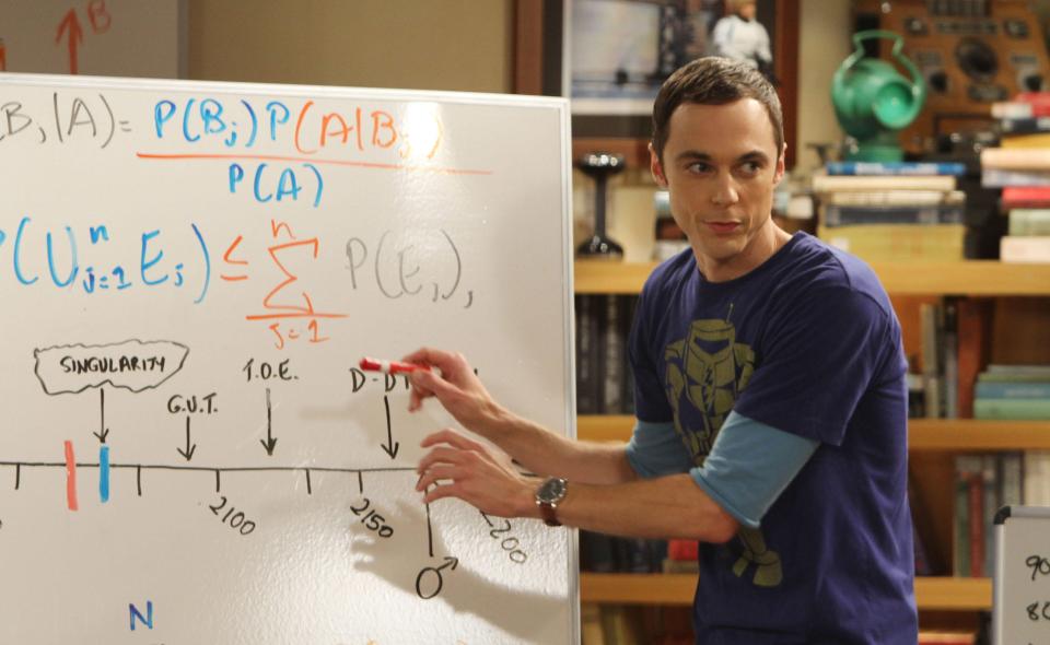 Sheldon Cooper from The Big Bang Theory writing equations on a whiteboard.