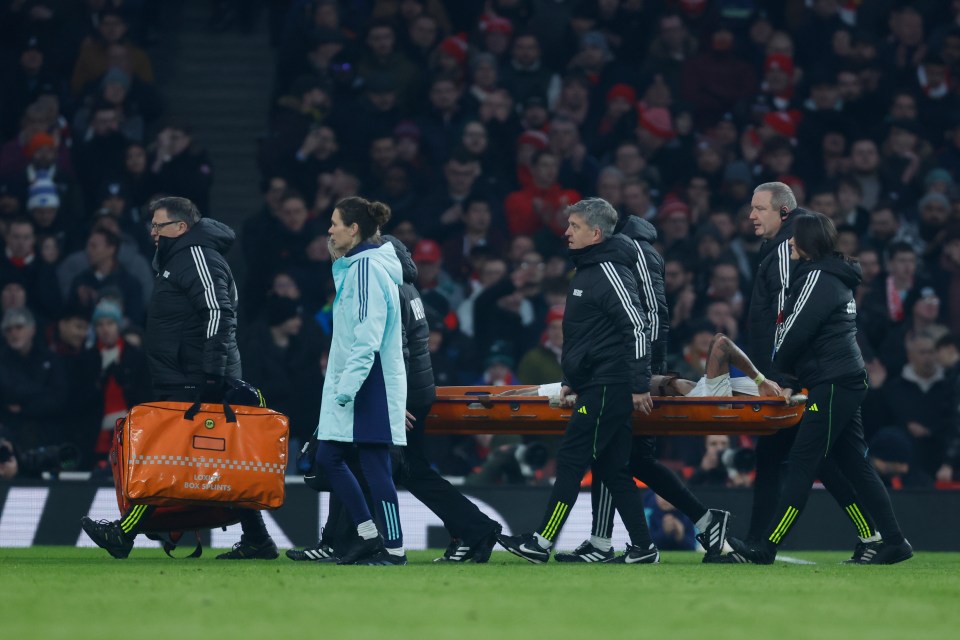 Arsenal's Gabriel Jesus being carried off on a stretcher.