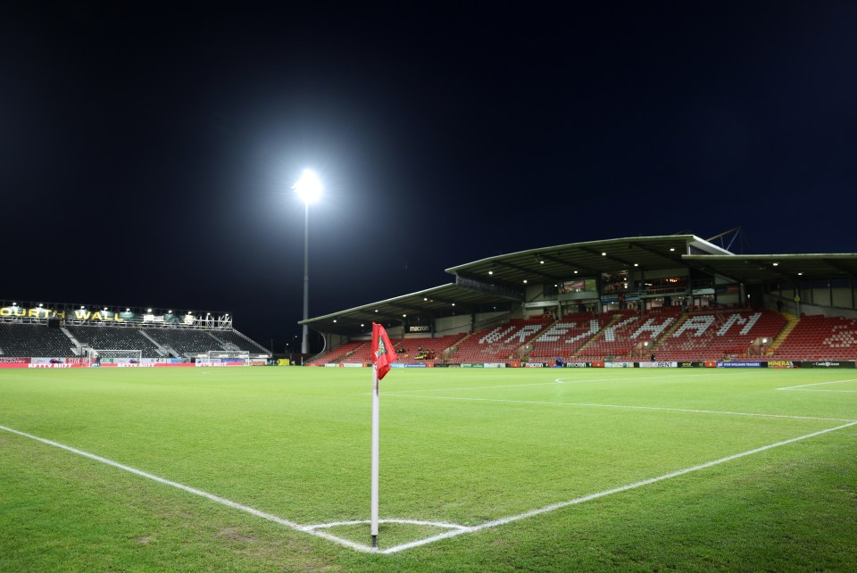 Empty soccer field at night before a match.