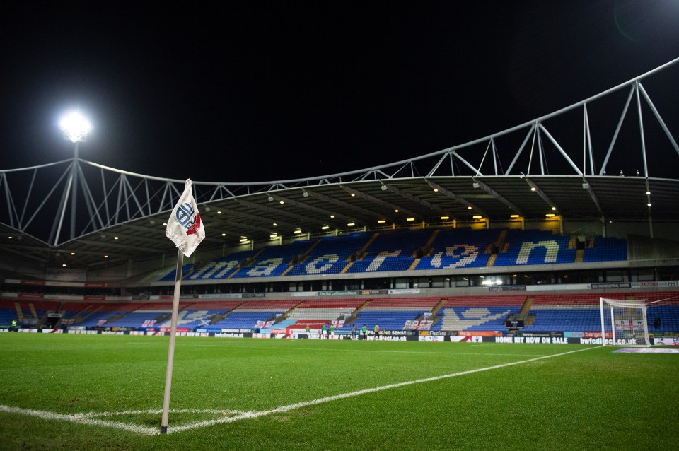 Empty soccer stadium at night.