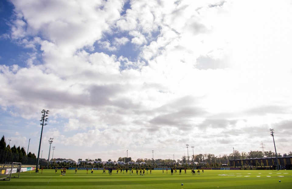 Soccer players training on a field.