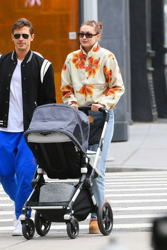 Gigi Hadid strolling with her daughter Khai and a friend.