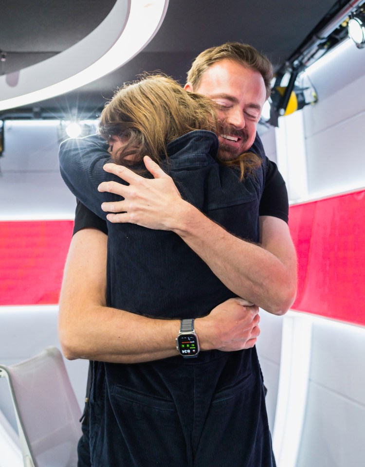 Jamie Theakston and Davina McCall hugging.