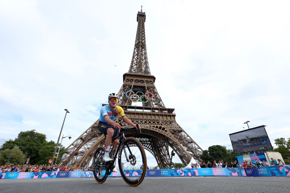 Remco Evenepoel holding two gold medals.