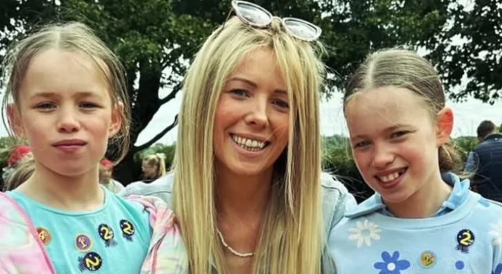 A woman with two young girls.