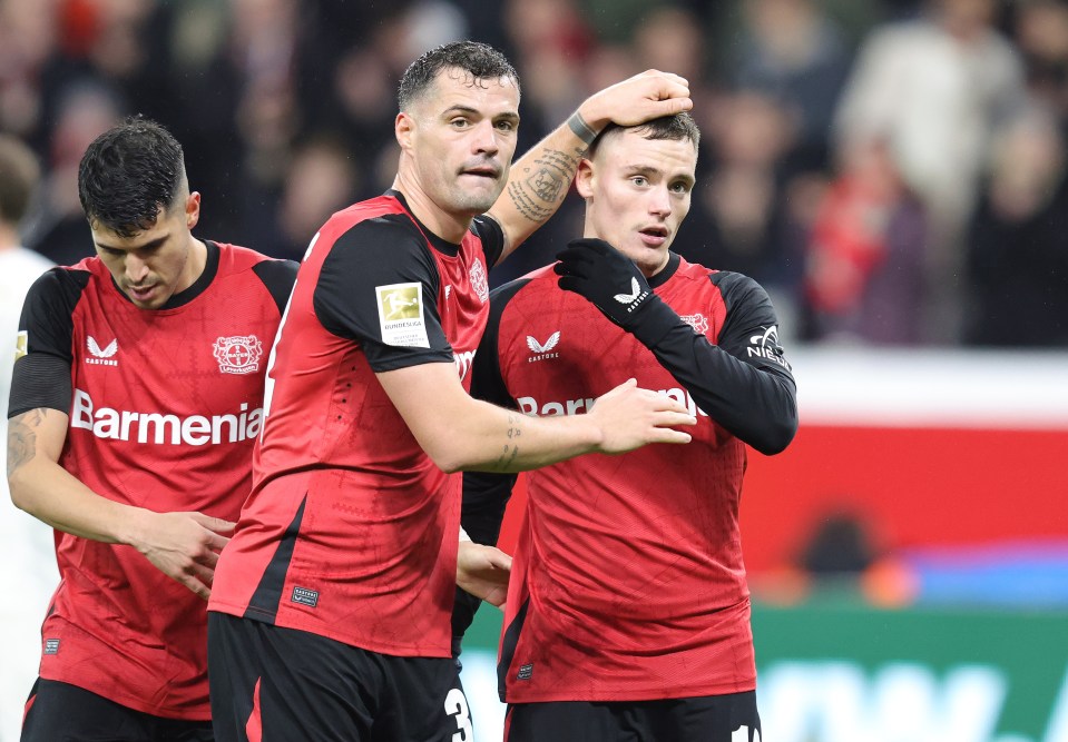 Granit Xhaka and Florian Wirtz of Bayer Leverkusen celebrate.