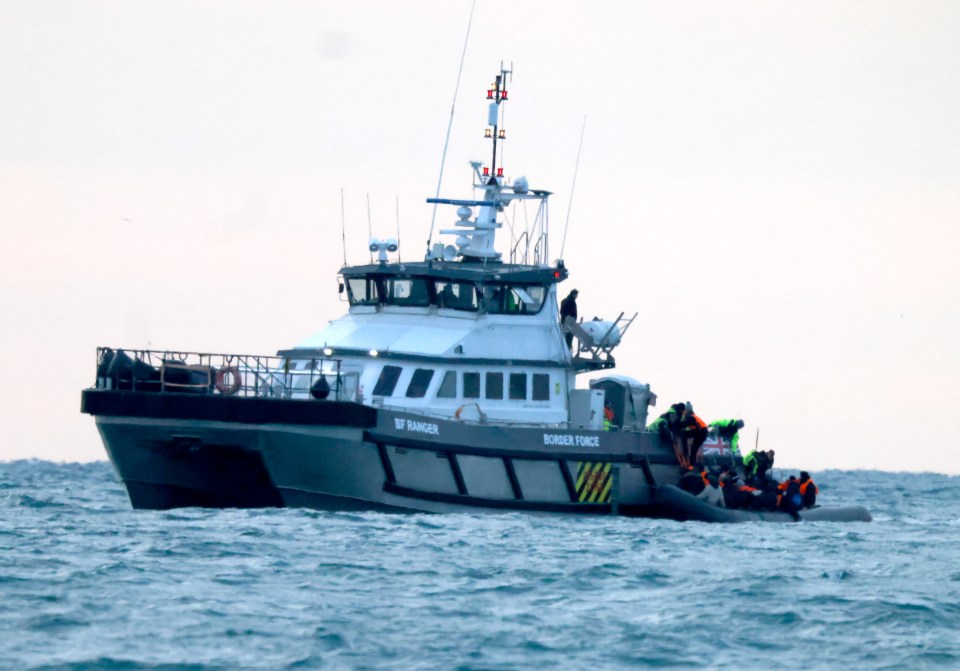 The Border Force intercepts illegal migrants crossing the channel in a small boat