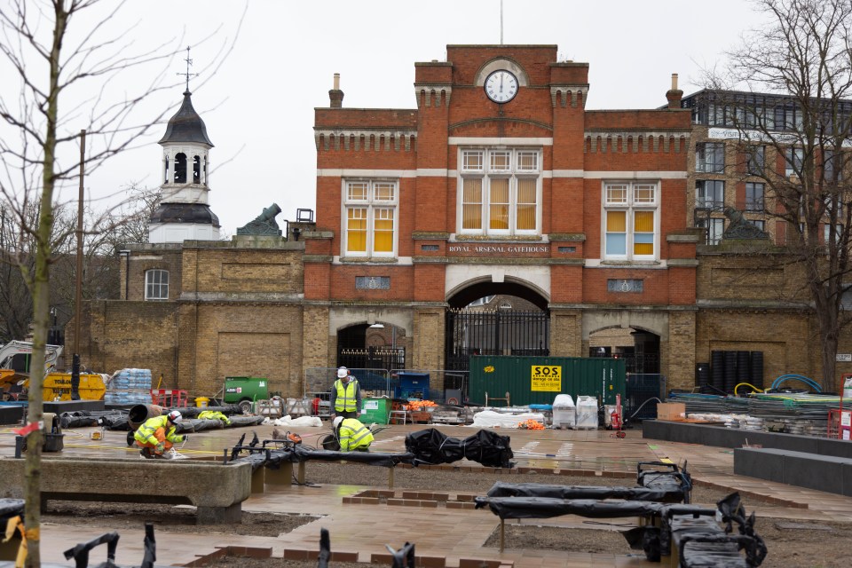 Construction workers outside the Royal Arsenal Gatehouse.