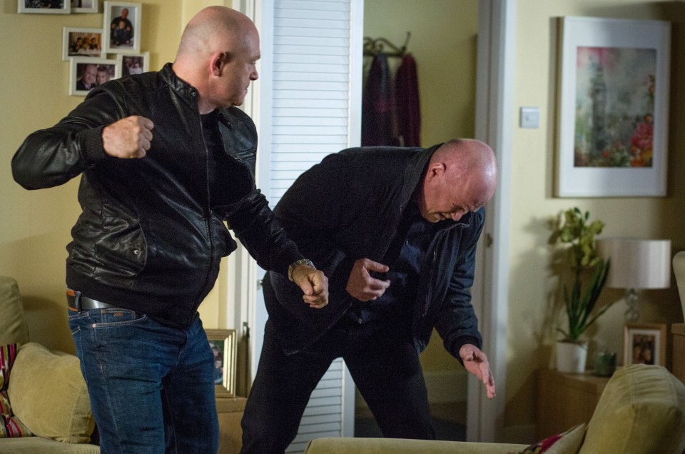 Phil Mitchell lashes out at his brother, Grant Mitchell.