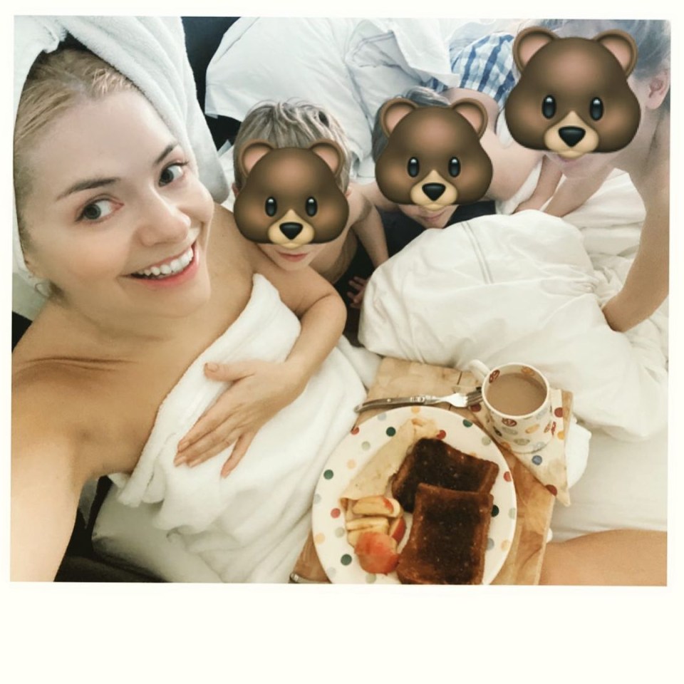 Holly Willoughby in a bathrobe with her children and breakfast in bed.