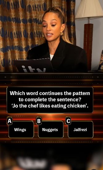 Holly Willoughby reading a quiz question: "Jo the chef likes eating chicken."  The options are wings, nuggets, and jalfrezi.