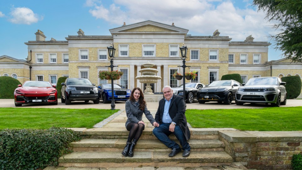 Peter Waddell, 58, with his wife Gabby and some of their cars pictured outside their home