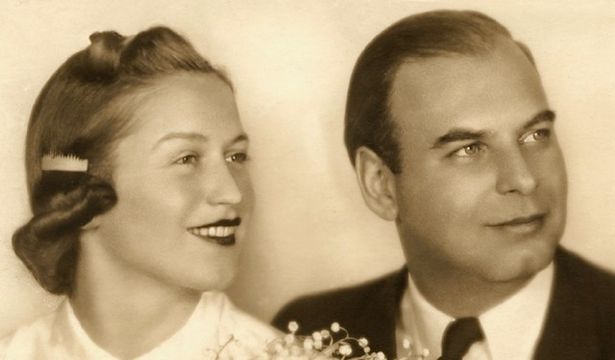 Sepia-toned wedding photo of a young couple.