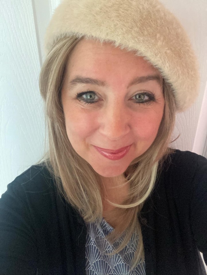 Portrait of a woman wearing a beige beret.