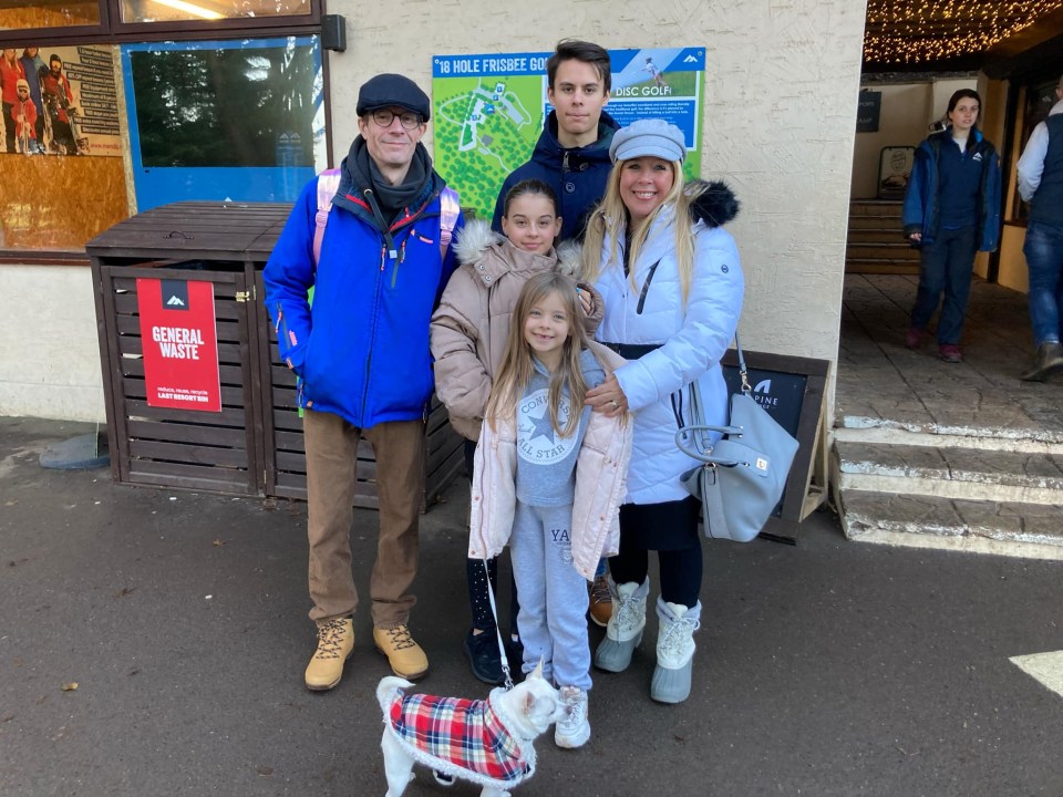 Family portrait in front of a building.