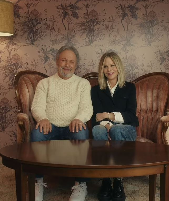 Two 90s movie stars sitting on a couch.