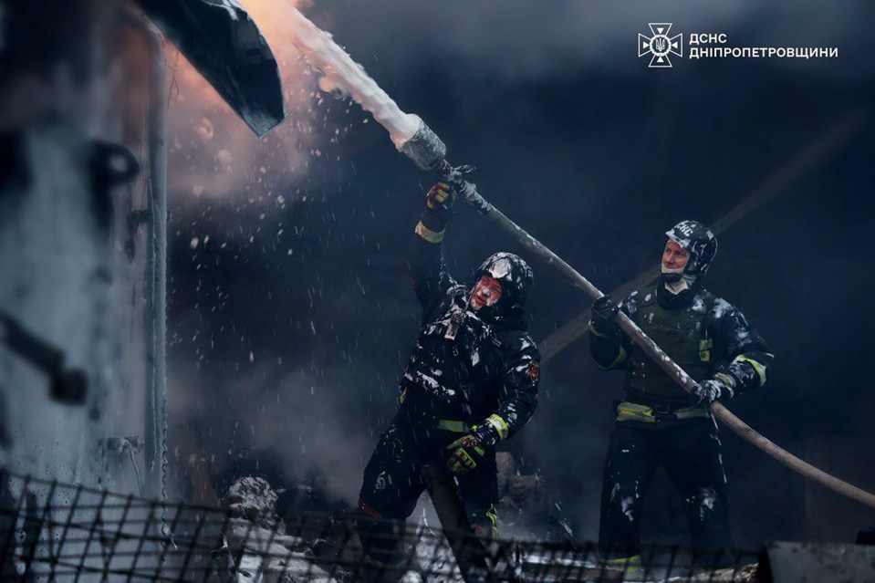 Ukrainian firefighters put out a fire following a missile attack in Dnipropetrovsk region, Ukraine