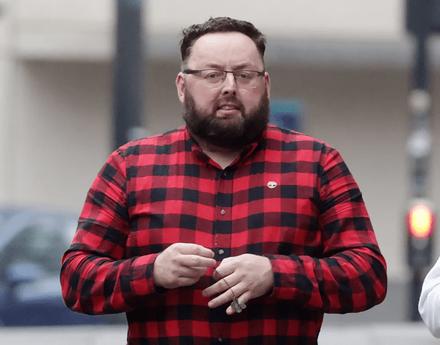 Man in red and black plaid shirt.