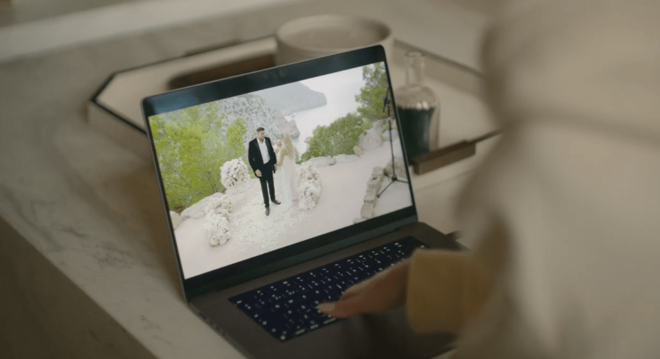 Laptop displaying a wedding video.